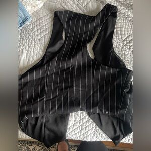 Size small vest very very cute! Good condition too!